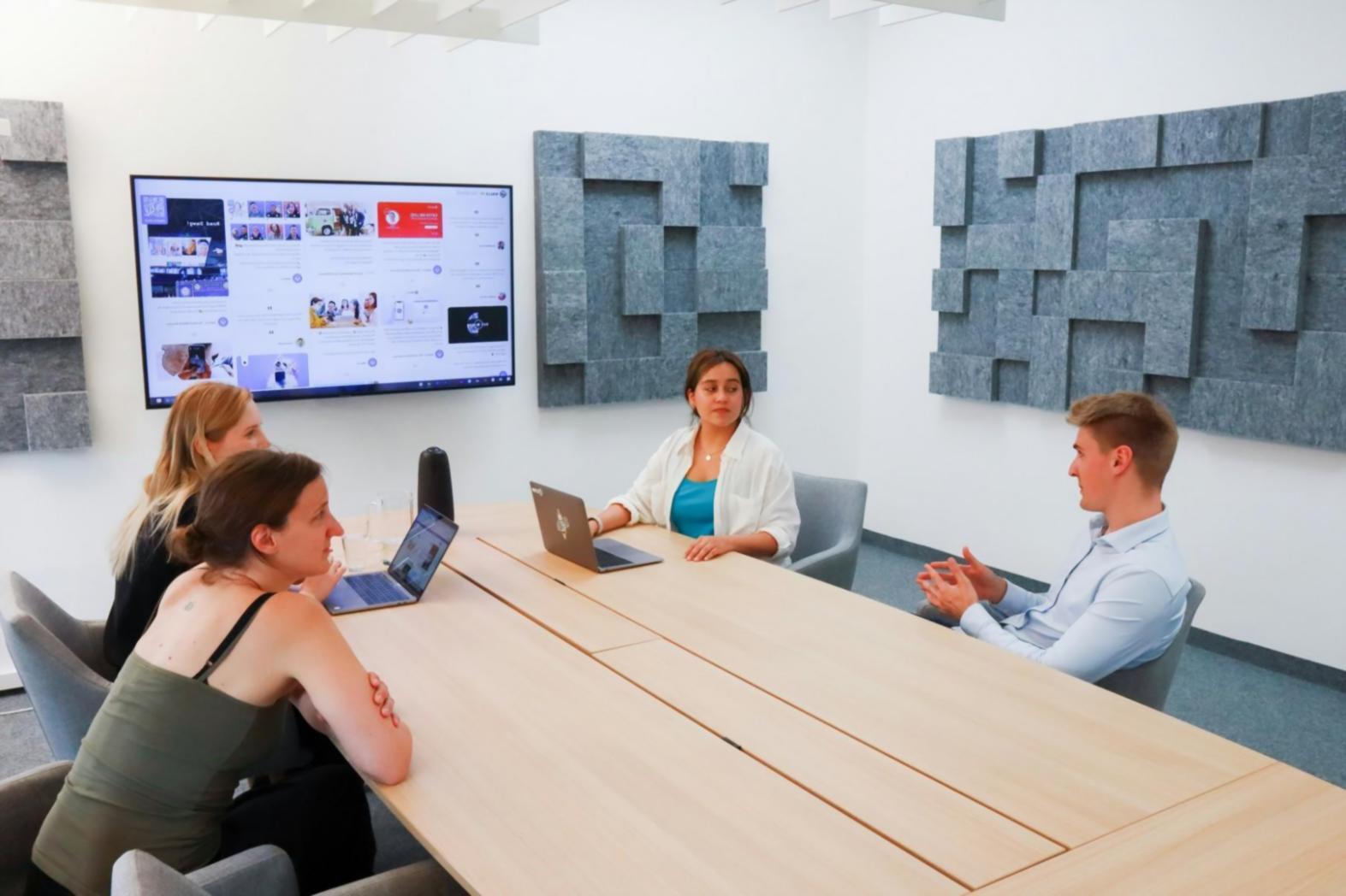 Team meeting discussing quarterly financial forecasts and budget adjustments